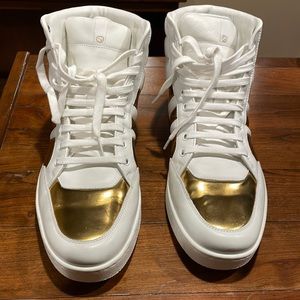 White and gold hightop Gucci sneakers